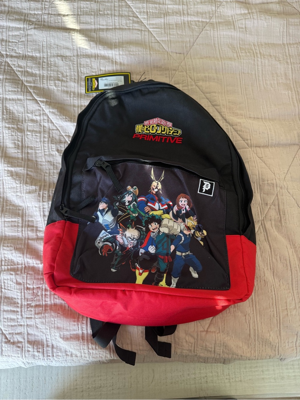 Primitive Black Backpack with Yellow Accent Tag